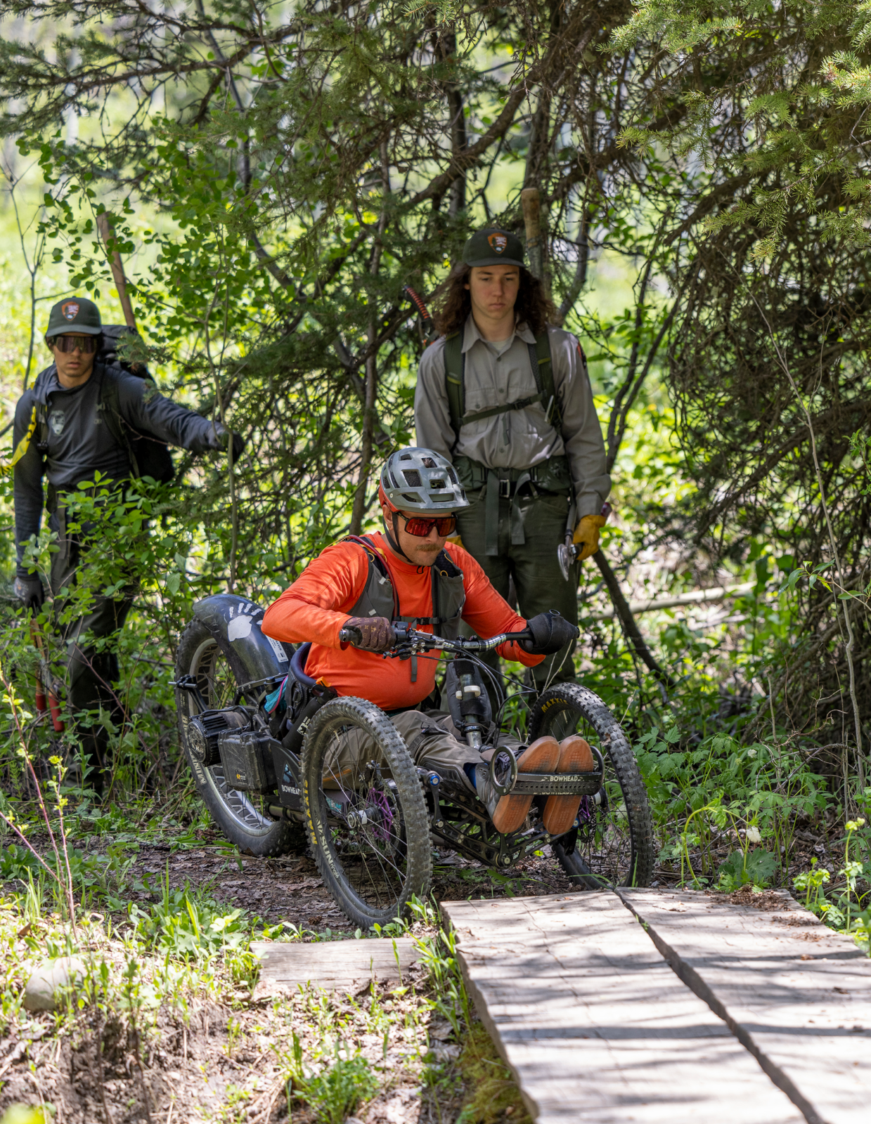 GTNPFTwoOceansTrailCrew-4159 Joe Stone demonstrates accessibility challenges with certain types of bridges to Grand Teton's trail crew members.